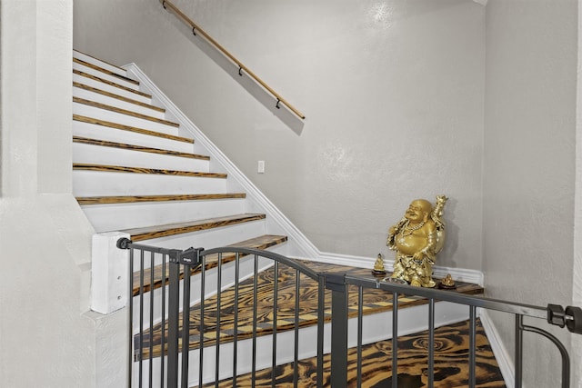 10393 Duncan Rd, Beaumont, TX 77713 - staircase with a textured wall