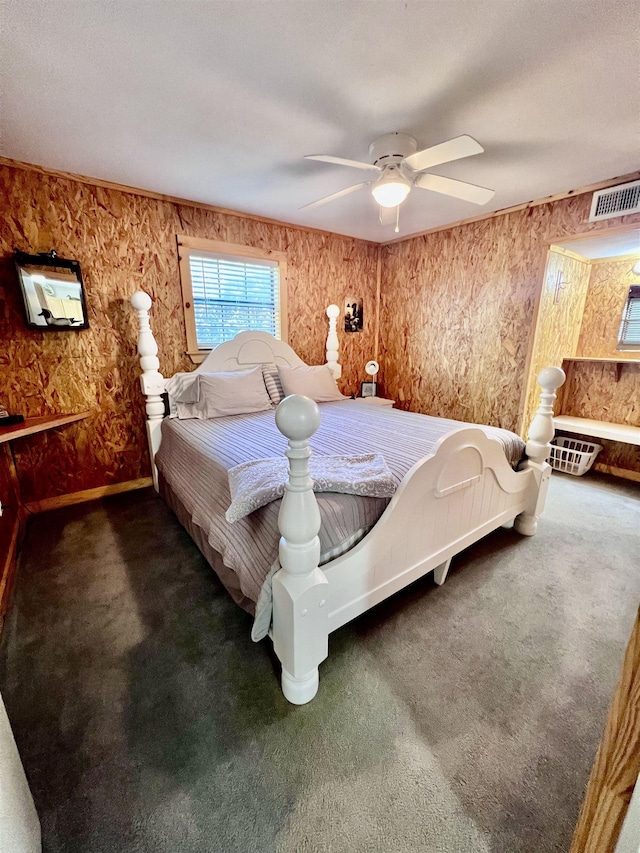 carpeted bedroom with ceiling fan and visible vents