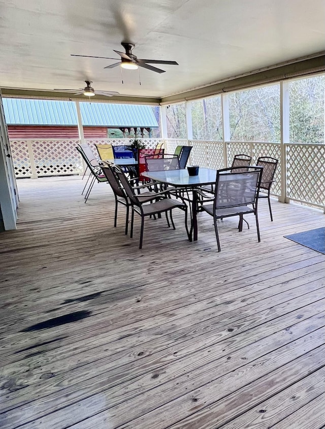 deck with ceiling fan and outdoor dining space