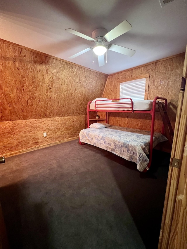 bedroom featuring ceiling fan and carpet