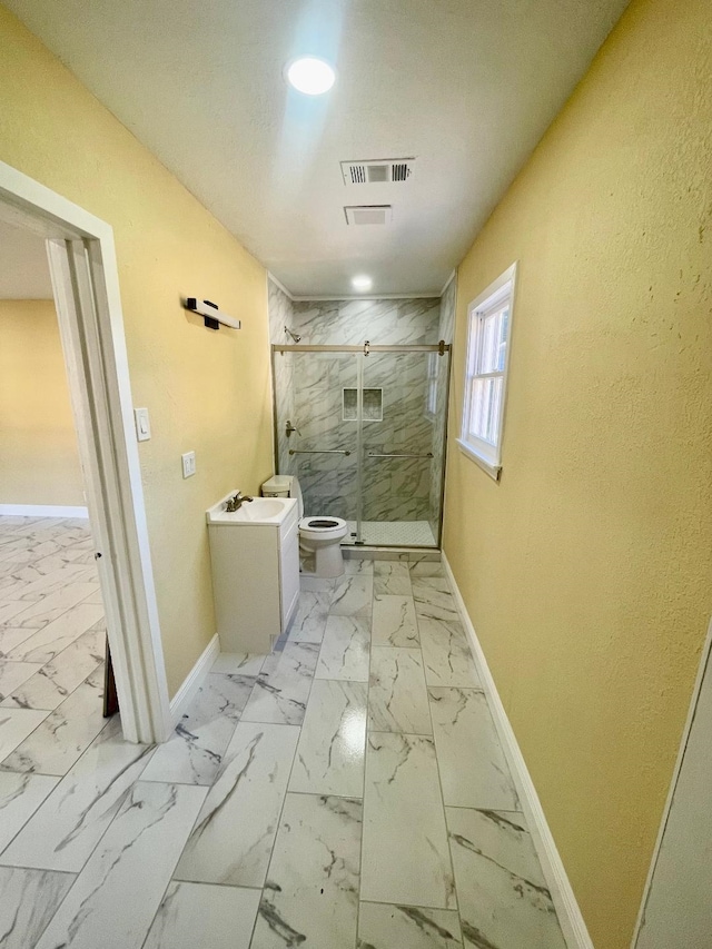 bathroom with toilet and walk in shower