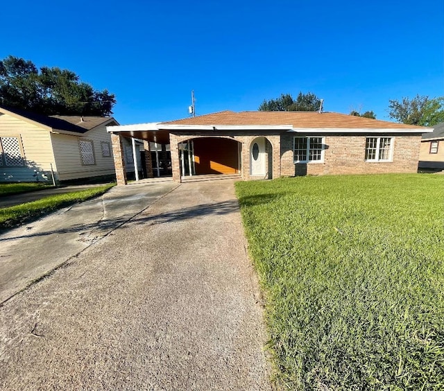 single story home featuring a carport and a front yard