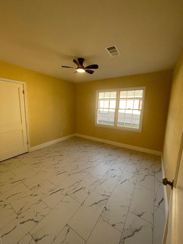 empty room featuring ceiling fan