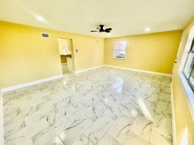 empty room featuring ceiling fan