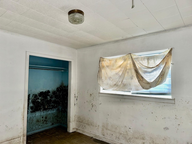 733 Phyllis Ave, Port Arthur, TX 77640 - unfurnished bedroom with crown molding and a closet