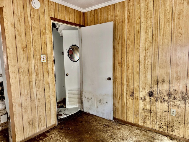 733 Phyllis Ave, Port Arthur, TX 77640 - interior space featuring wood walls, crown molding, carpet, and a smoke detector