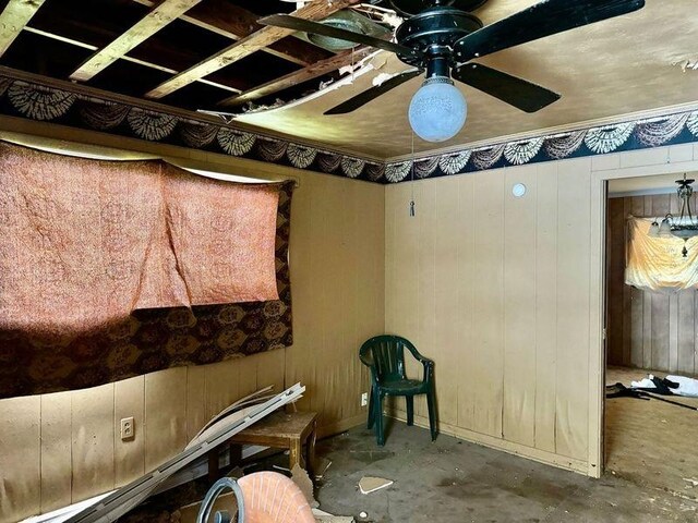 733 Phyllis Ave, Port Arthur, TX 77640 - misc room featuring concrete flooring, a ceiling fan, and wood walls
