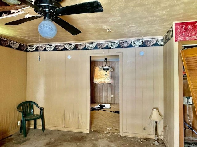 733 Phyllis Ave, Port Arthur, TX 77640 - miscellaneous room with unfinished concrete floors, a ceiling fan, and baseboards