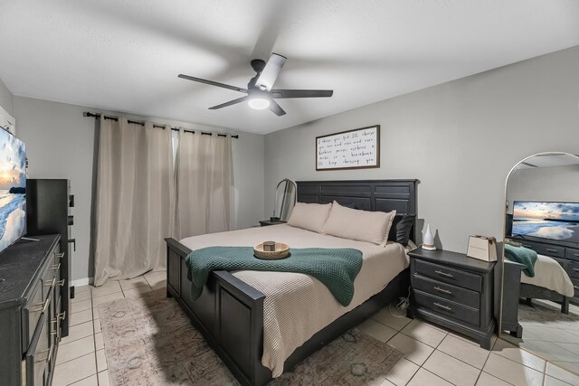 1432 W Palm Dr, Winnie, TX 77665 - bedroom with light tile patterned floors and ceiling fan