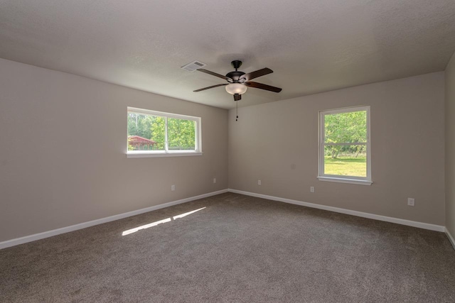 319 Pinemont Dr, Beaumont, TX 77659 - carpeted spare room with visible vents, a ceiling fan, and baseboards
