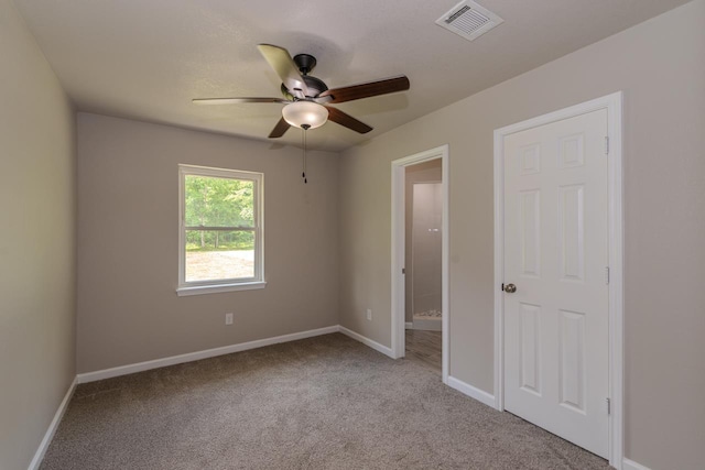 319 Pinemont Dr, Beaumont, TX 77659 - carpeted spare room featuring ceiling fan, visible vents, and baseboards