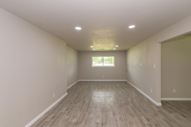 319 Pinemont Dr, Beaumont, TX 77659 - unfurnished room featuring recessed lighting, light wood-style flooring, and baseboards