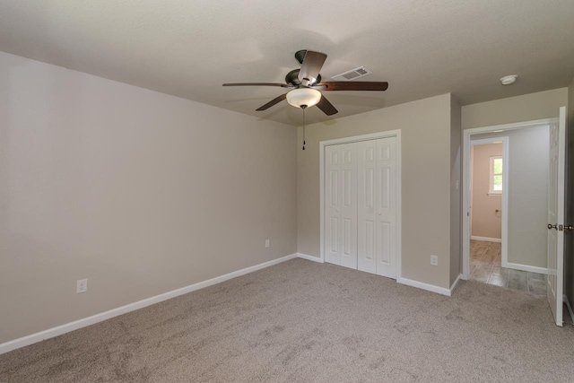 319 Pinemont Dr, Beaumont, TX 77659 - unfurnished bedroom featuring carpet floors, a ceiling fan, baseboards, visible vents, and a closet