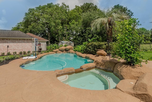 7640 Merion Dr, Beaumont, TX 77707 - view of swimming pool with a patio area and a pool with connected hot tub