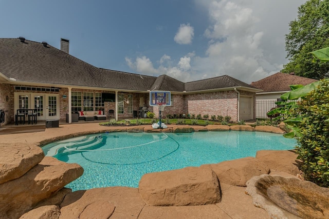 7640 Merion Dr, Beaumont, TX 77707 - outdoor pool with french doors and a patio