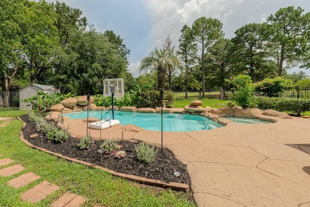 7640 Merion Dr, Beaumont, TX 77707 - view of pool with an in-ground hot tub, a fenced backyard, a patio area, and view of scattered trees