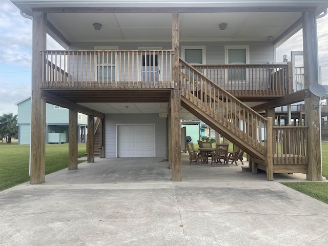 exterior space featuring a porch, a yard, and a garage