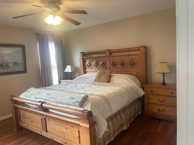 bedroom featuring ceiling fan, dark hardwood / wood-style floors, and a textured ceiling