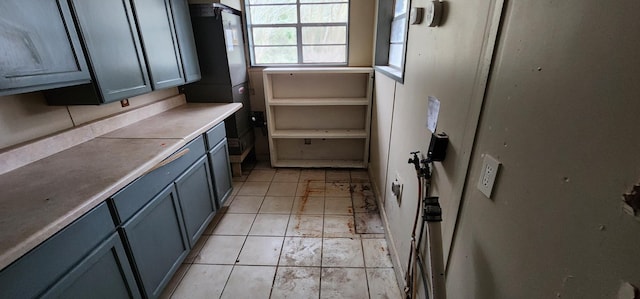 kitchen featuring light tile patterned flooring