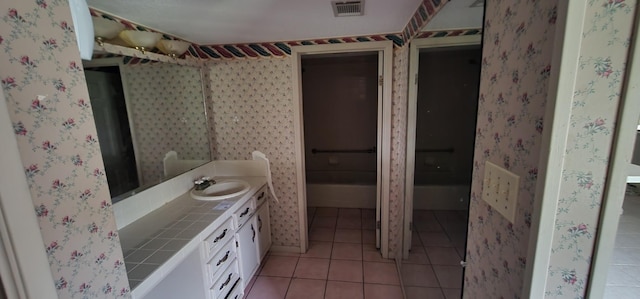 bathroom with vanity and tile patterned floors