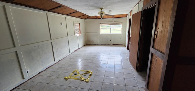 hall with light tile patterned floors