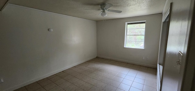 unfurnished room with ceiling fan and a textured ceiling