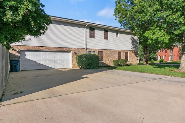 view of property exterior featuring a garage and a yard