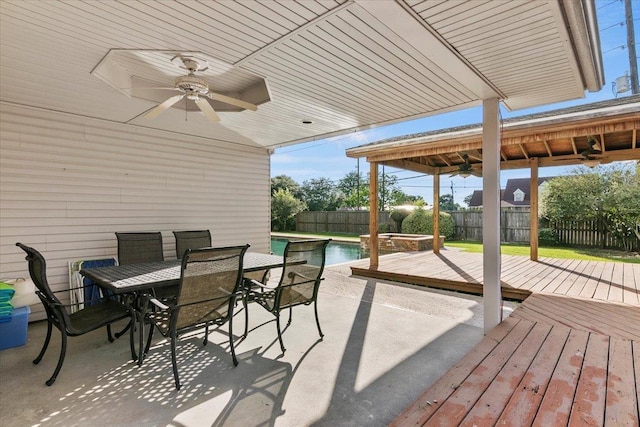 view of patio with ceiling fan and a pool side deck