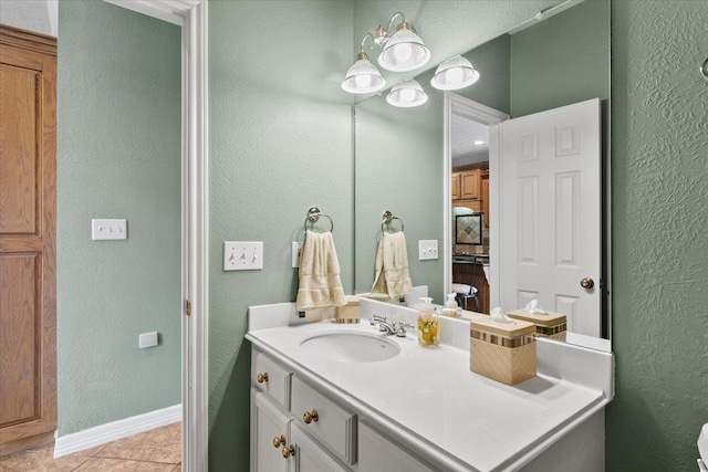 bathroom with tile patterned flooring and vanity