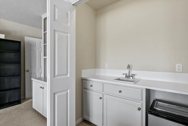 bathroom with vanity and a textured ceiling