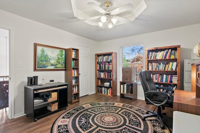 home office featuring a textured ceiling, hardwood / wood-style flooring, and ceiling fan