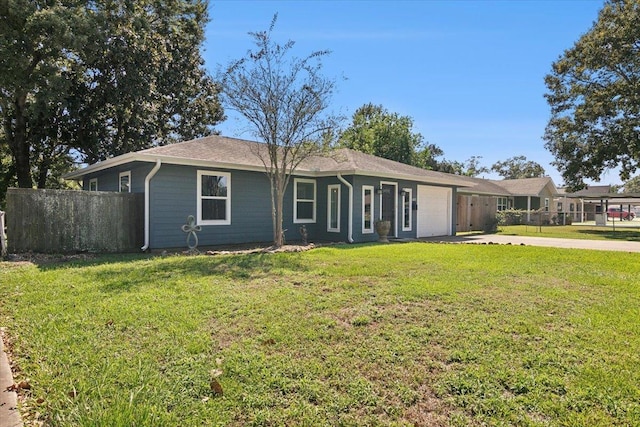 ranch-style house featuring a garage and a front yard