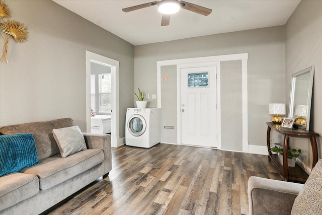 living room with washer / clothes dryer, ceiling fan, and dark hardwood / wood-style flooring