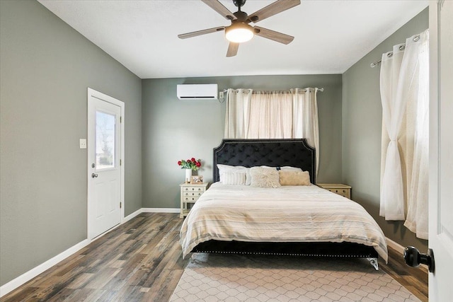 bedroom featuring ceiling fan, hardwood / wood-style floors, and a wall mounted AC