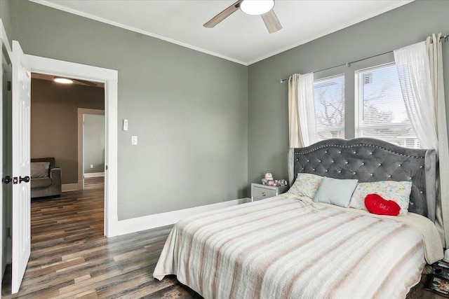 bedroom featuring dark hardwood / wood-style flooring, crown molding, and ceiling fan