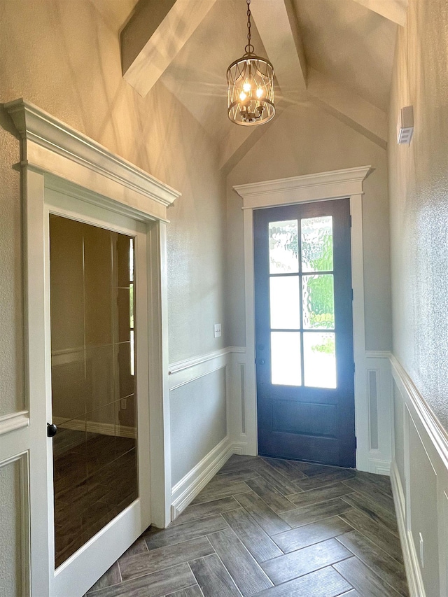 doorway to outside featuring dark parquet floors and an inviting chandelier