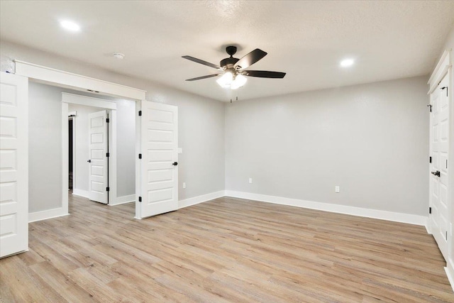 unfurnished bedroom featuring ceiling fan and light hardwood / wood-style flooring