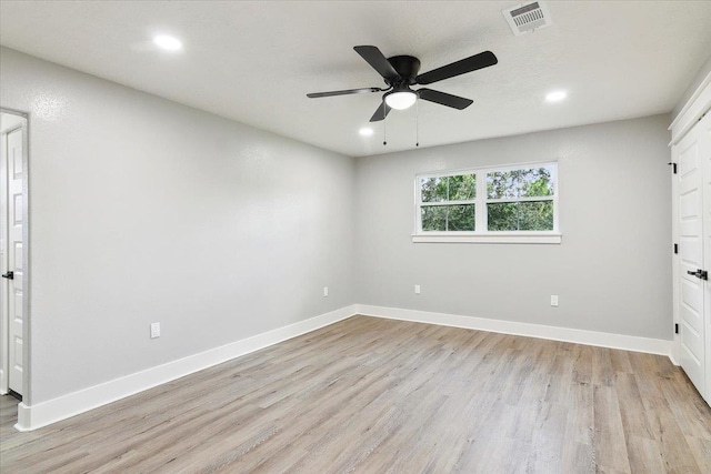 unfurnished bedroom featuring light wood-type flooring and ceiling fan