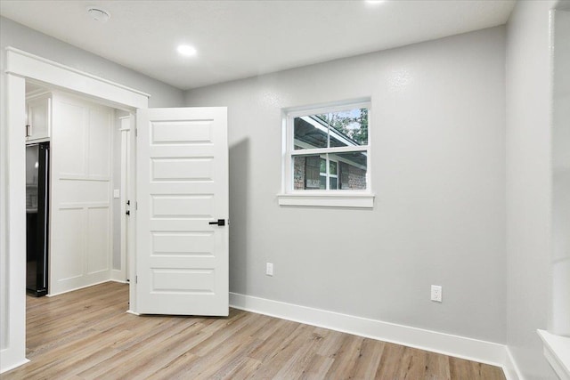 unfurnished room featuring light wood-type flooring