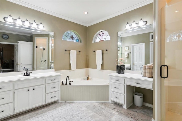 bathroom featuring a garden tub, vanity, ornamental molding, and a stall shower