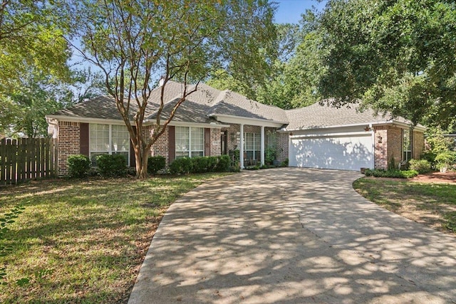 ranch-style home featuring fence, driveway, brick siding, and a garage