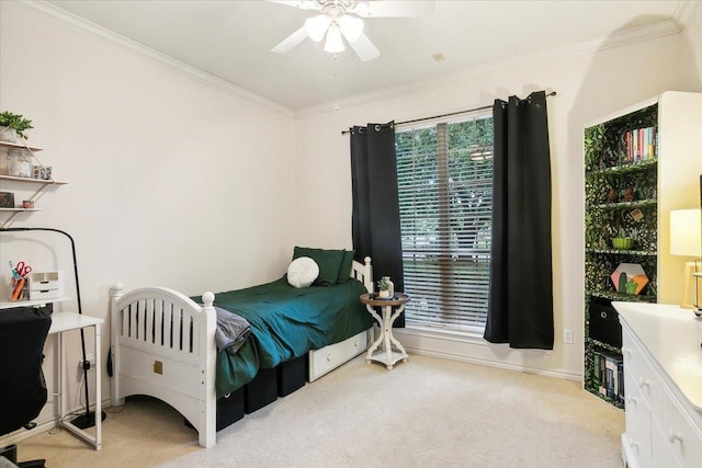 bedroom featuring ceiling fan, light carpet, and crown molding