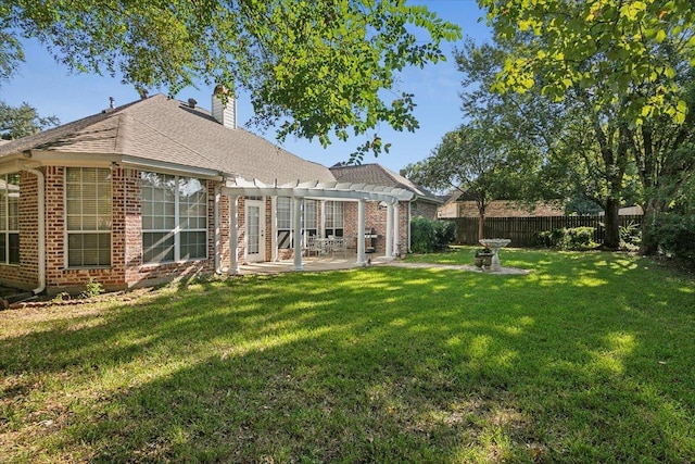 view of yard featuring a pergola, a patio area, and a fenced backyard