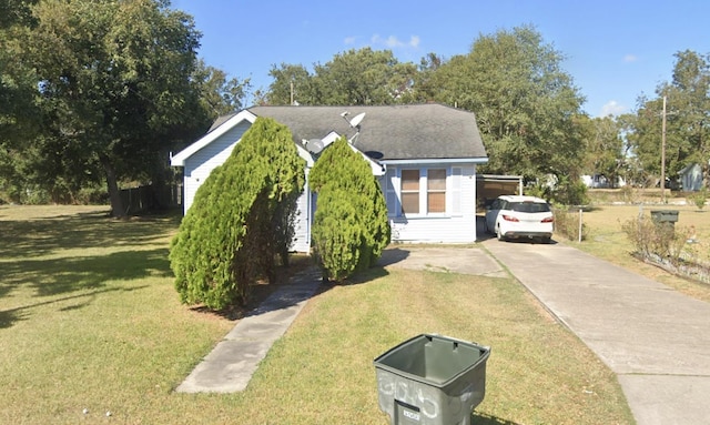 5015 8th St, Port Arthur, TX 77642 - view of front facade with a front yard and concrete driveway