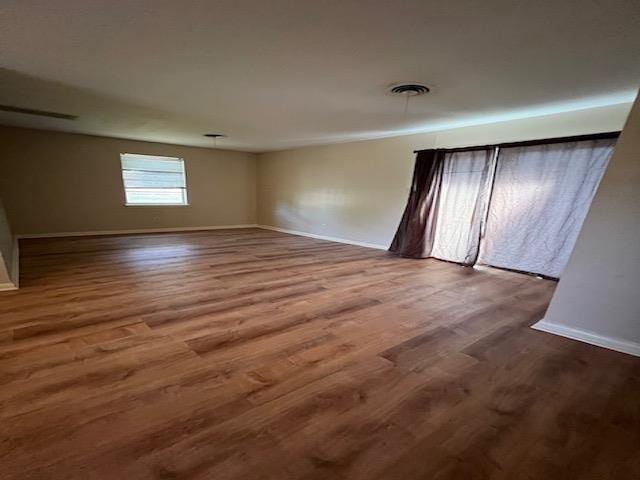 empty room featuring hardwood / wood-style floors