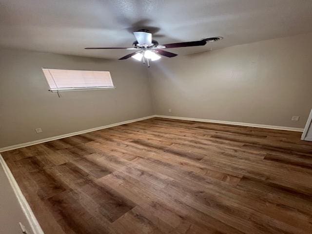 empty room featuring hardwood / wood-style floors and ceiling fan