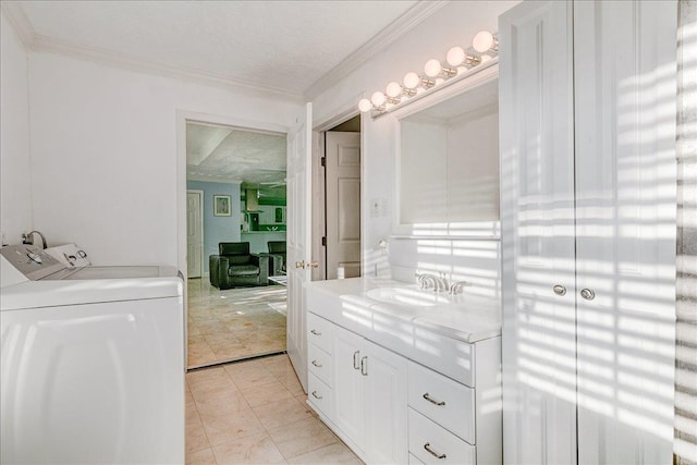 bathroom featuring washer and clothes dryer, ornamental molding, tile patterned floors, and a textured ceiling