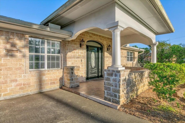 entrance to property with a porch