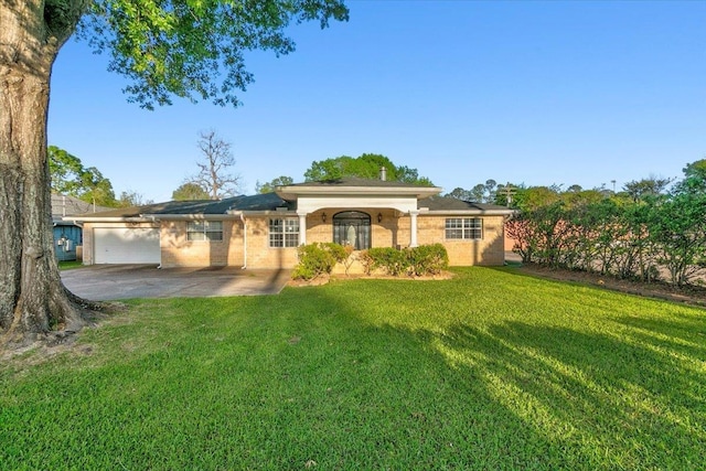 view of front of house with a garage and a front yard