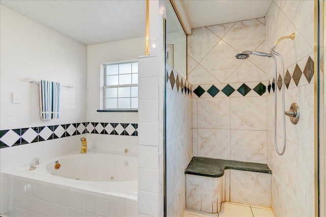 bathroom with tile patterned floors and separate shower and tub